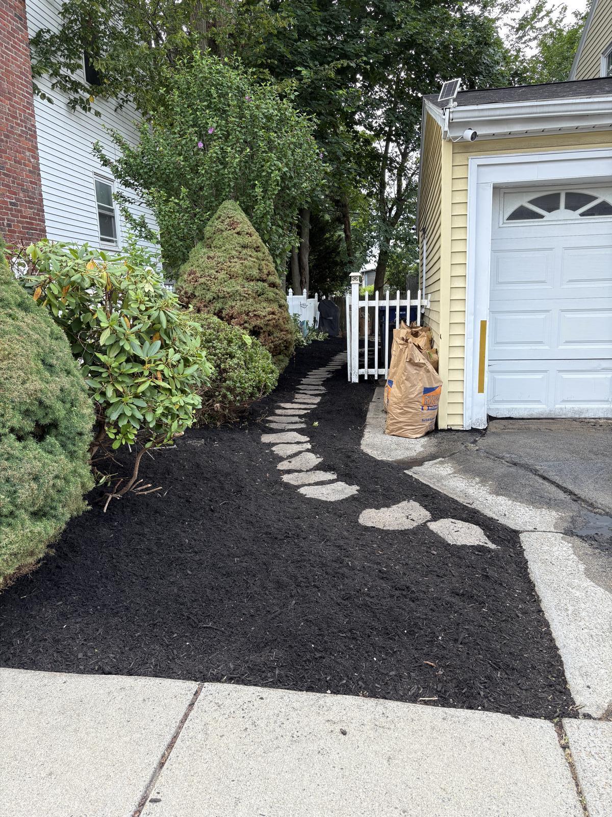 Fresh mulch bed and edging after cleanup