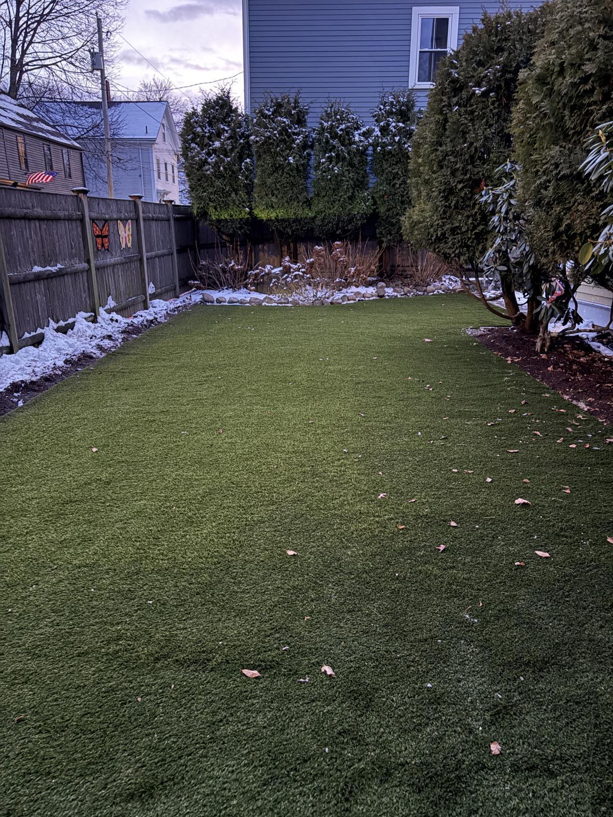 Finished artificial turf backyard installation